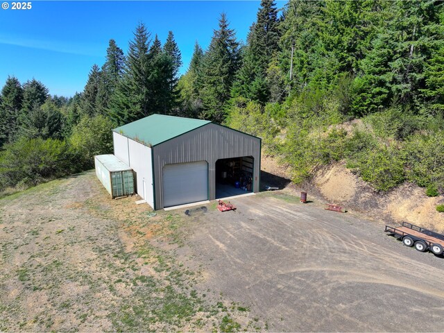 25500 Cape View Loop, Gold Beach, OR 97444 - detached garage featuring a view of trees