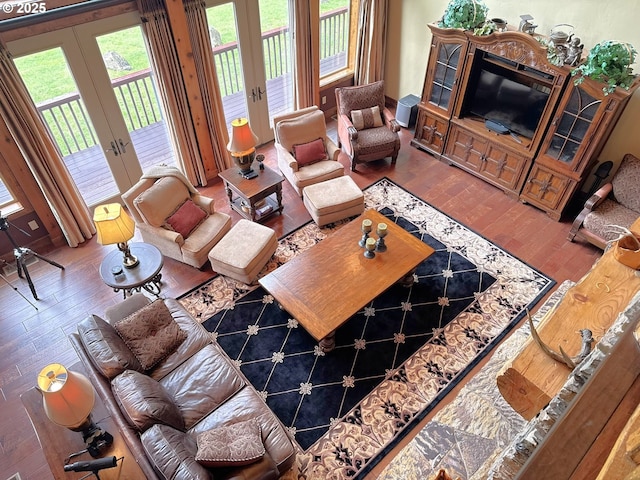 living room featuring french doors and hardwood / wood-style flooring