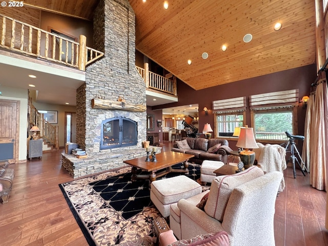 living area with wood ceiling, a fireplace, high vaulted ceiling, and hardwood / wood-style flooring