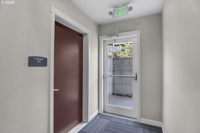 entryway featuring baseboards