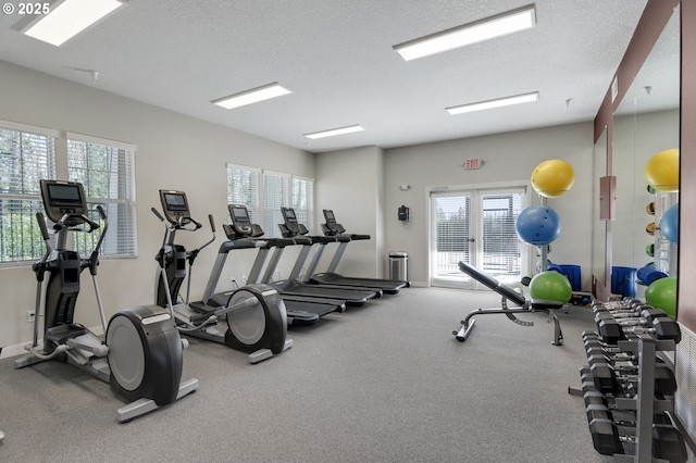 workout area with a textured ceiling