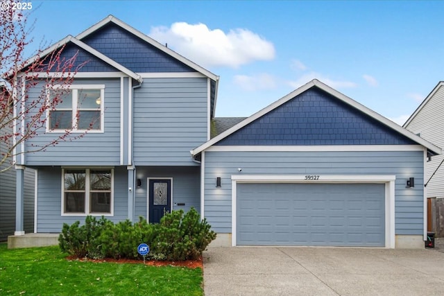 view of front of property featuring an attached garage and driveway