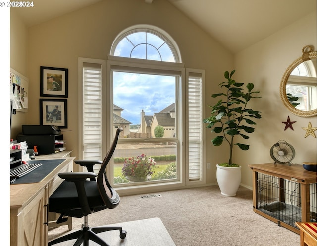 carpeted home office with vaulted ceiling with beams