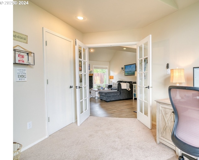 interior space with carpet and french doors