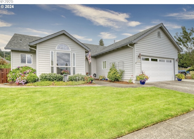 single story home with a front yard and a garage