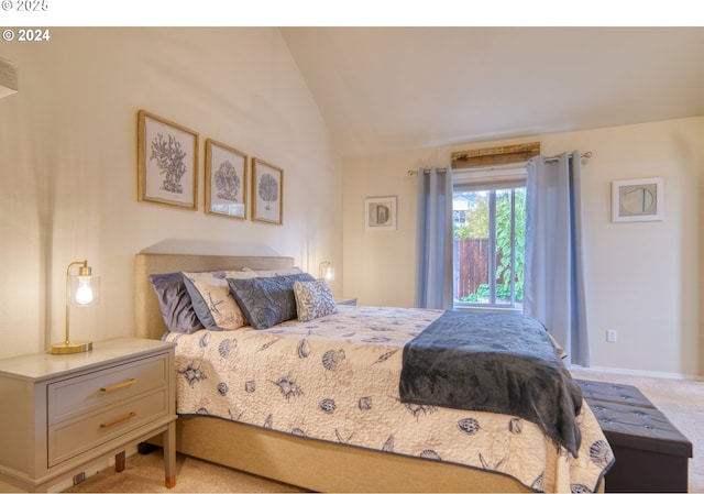 carpeted bedroom featuring vaulted ceiling