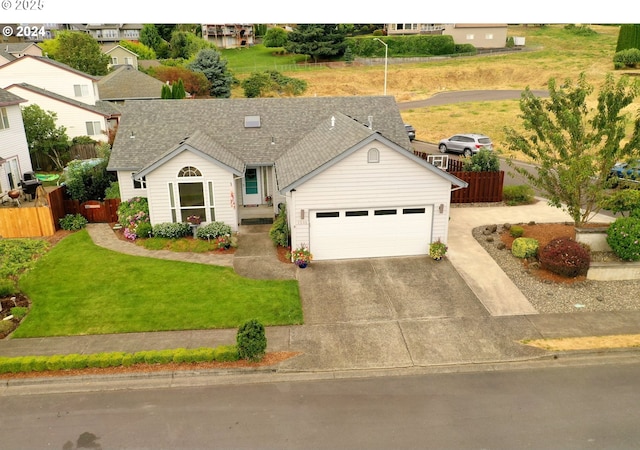 ranch-style house with a garage and a front yard