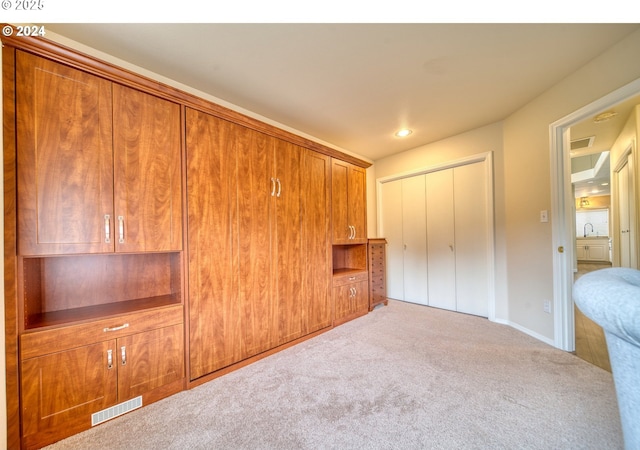 unfurnished bedroom with a closet and carpet flooring