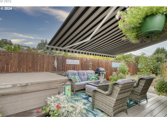 wooden deck featuring an outdoor living space, a hot tub, and grilling area