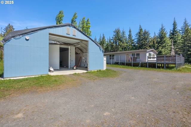 view of pole building featuring driveway