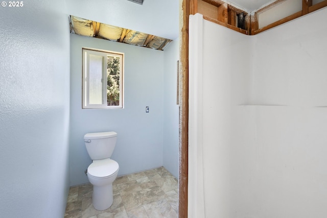 bathroom featuring toilet