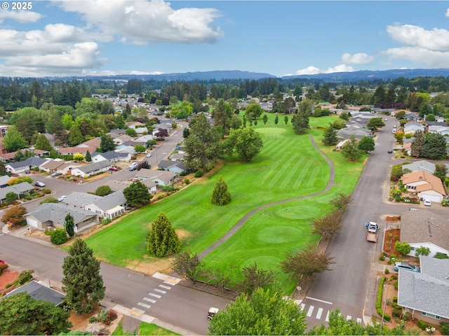 birds eye view of property featuring view of golf course and a residential view