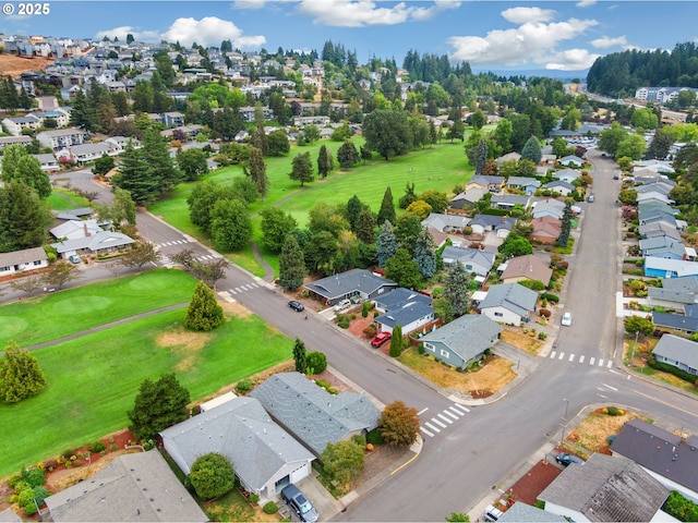 birds eye view of property with a residential view