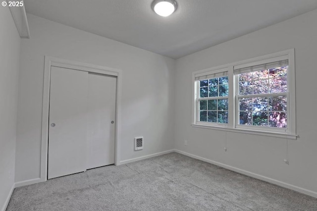 2805 SE Hawthorne Blvd Unit B, Portland, OR 97214 - unfurnished bedroom with carpet, baseboards, and a closet
