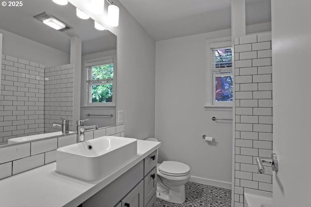 2805 SE Hawthorne Blvd Unit B, Portland, OR 97214 - bathroom featuring vanity, toilet, tile patterned flooring, and baseboards