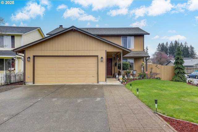 view of front of house with a garage, roof with shingles, fence, a front lawn, and driveway