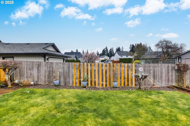 view of yard with a residential view and fence