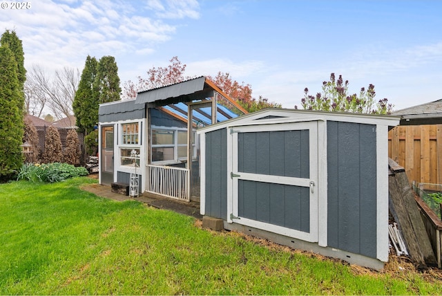 view of shed with fence