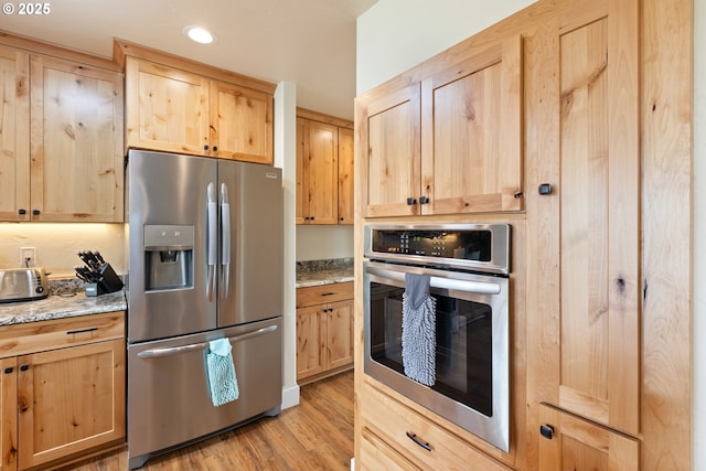 910 Swallow Ave, Sutherlin, OR 97479 - kitchen featuring appliances with stainless steel finishes, light brown cabinets, and recessed lighting