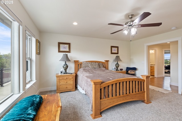 910 Swallow Ave, Sutherlin, OR 97479 - carpeted bedroom featuring multiple windows, access to outside, a ceiling fan, baseboards, and recessed lighting