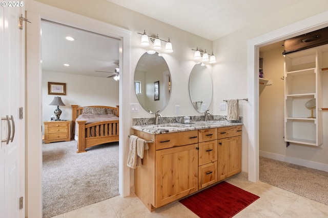 910 Swallow Ave, Sutherlin, OR 97479 - ensuite bathroom featuring double vanity, ceiling fan, baseboards, and recessed lighting