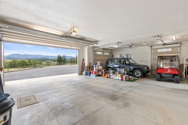 910 Swallow Ave, Sutherlin, OR 97479 - garage with a mountain view and a garage door opener