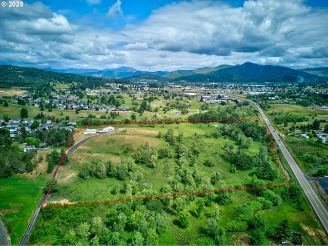 910 Swallow Ave, Sutherlin, OR 97479 - aerial view of property and surrounding area with property boundaries highlighted and a mountainous background