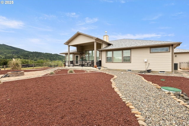 910 Swallow Ave, Sutherlin, OR 97479 - rear view of house featuring an outdoor fire pit, a chimney, a patio, crawl space, and a shingled roof