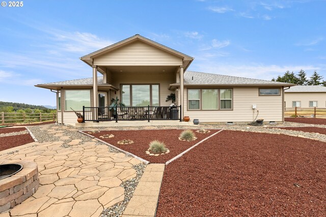 910 Swallow Ave, Sutherlin, OR 97479 - view of front of property featuring crawl space, a patio area, and a shingled roof