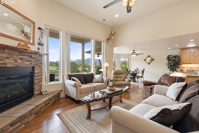 910 Swallow Ave, Sutherlin, OR 97479 - living area with ceiling fan, hardwood / wood-style floors, recessed lighting, a fireplace, and baseboards