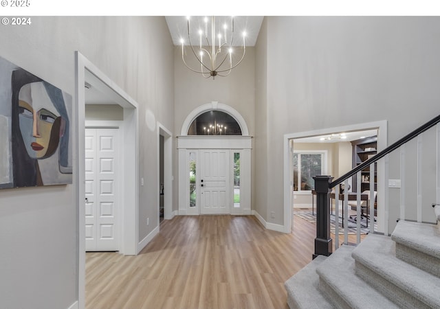 11509 NE 34th Ave, Vancouver, WA 98686 - foyer entrance featuring a chandelier, stairway, a high ceiling, wood finished floors, and baseboards