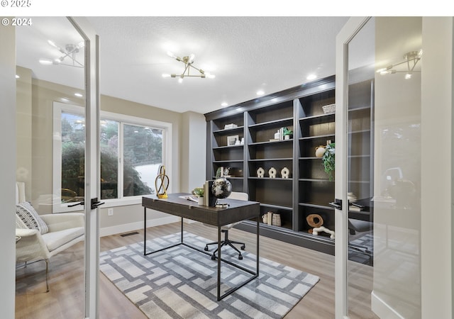 11509 NE 34th Ave, Vancouver, WA 98686 - home office with light wood finished floors, a textured ceiling, and french doors