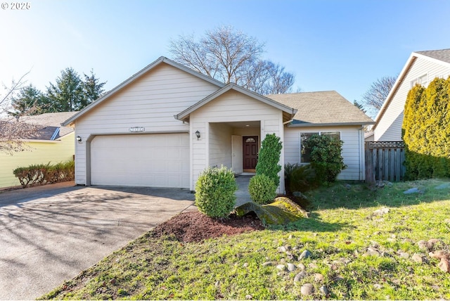 single story home with a front yard and a garage