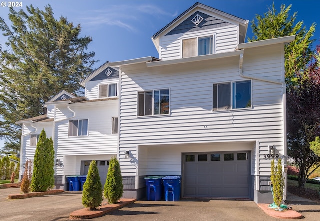 view of front of house with an attached garage and driveway