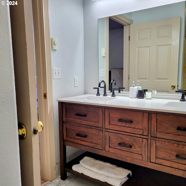 bathroom featuring double vanity and a sink