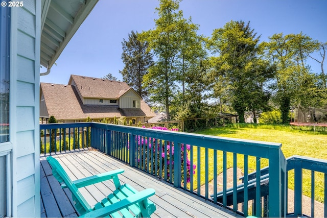 3979 NE Johns Ave, Neotsu, OR 97364 - wooden terrace featuring a trampoline and a lawn