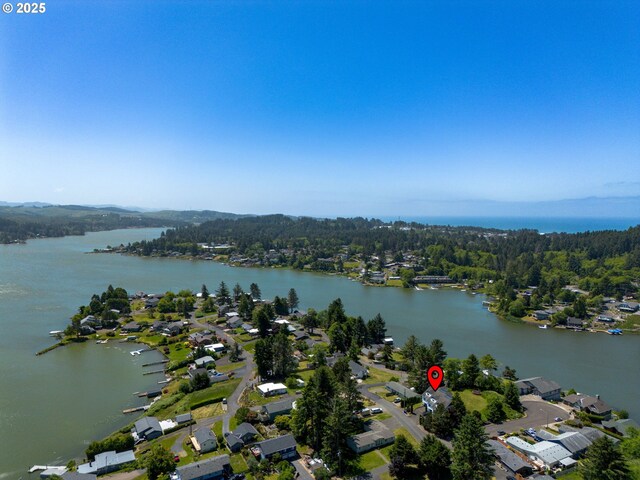 3979 NE Johns Ave, Neotsu, OR 97364 - aerial perspective of suburban area with a forest and a large body of water
