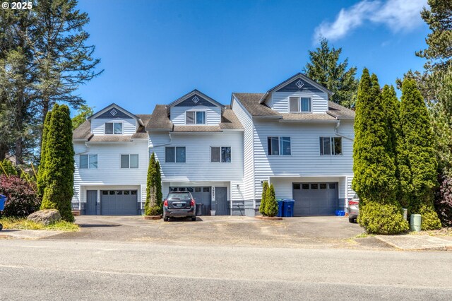 3979 NE Johns Ave, Neotsu, OR 97364 - view of front of property with a garage, a shingled roof, and asphalt driveway