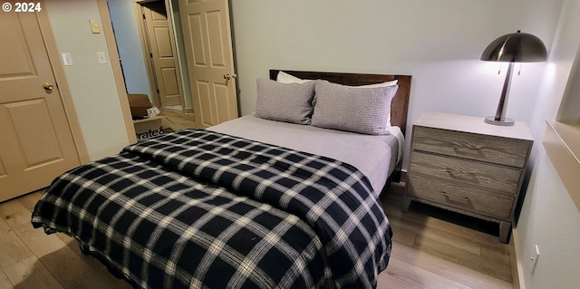 bedroom with wood finished floors