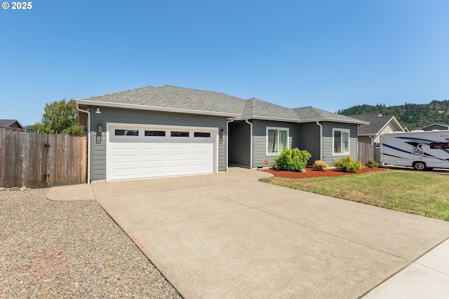360 NE Rose Ridge Dr, Winston, OR 97496 - ranch-style house with a garage, concrete driveway, and roof with shingles