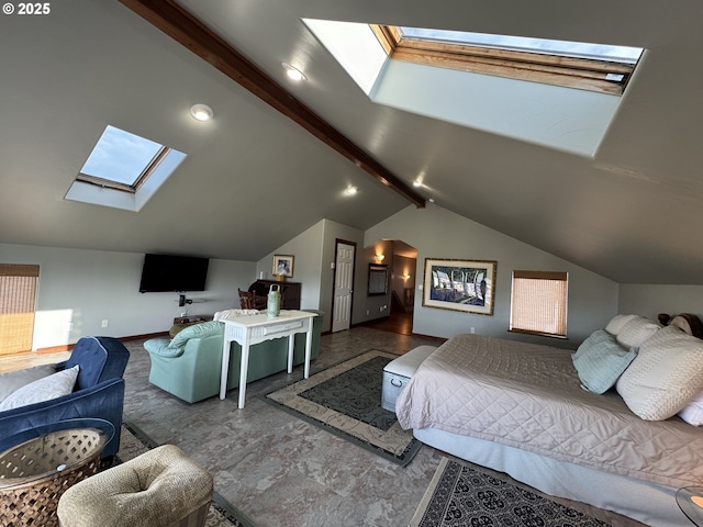 bedroom featuring lofted ceiling with skylight