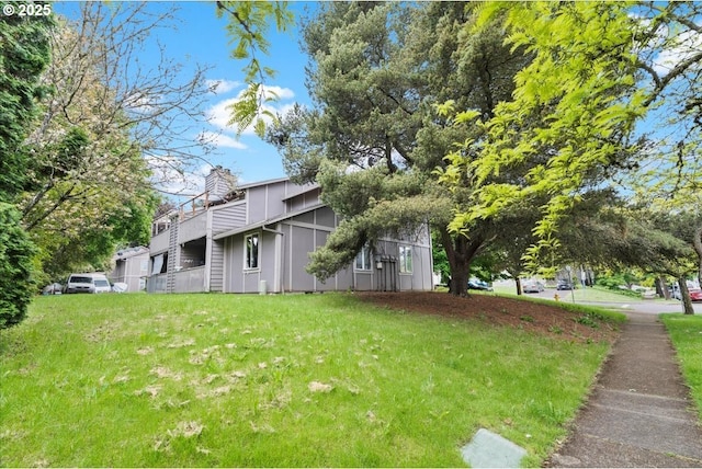 view of side of home featuring a chimney