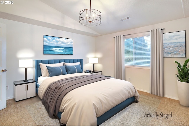 bedroom with an inviting chandelier, light colored carpet, and lofted ceiling