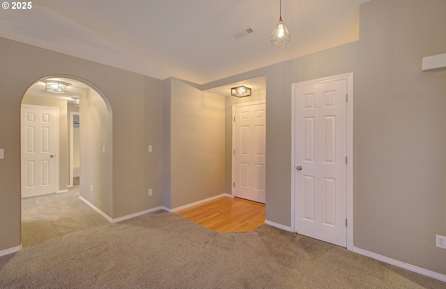 spare room with light colored carpet