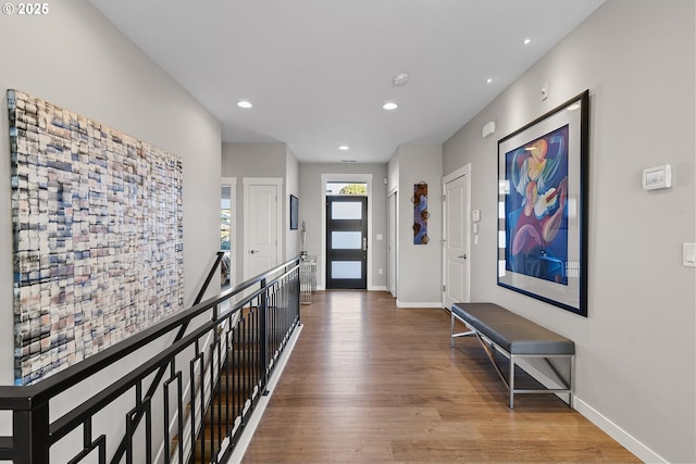 hall with hardwood / wood-style floors