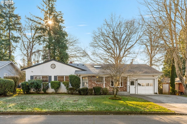 ranch-style home with a garage and a front lawn