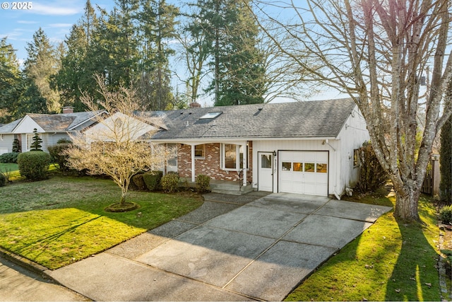 view of front of house featuring a garage and a front lawn