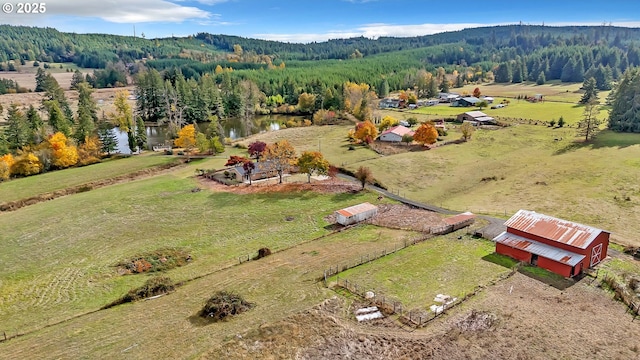 bird's eye view featuring a rural view and a water view