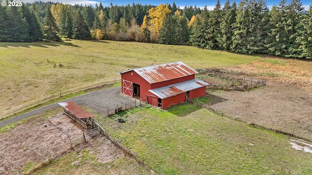 birds eye view of property featuring a rural view