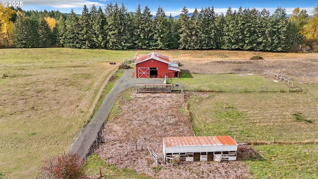 birds eye view of property featuring a rural view